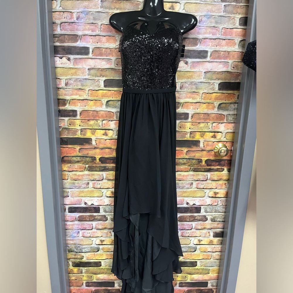 A fully sequined, strapless bodice, sweetheart neckline hi low skirt